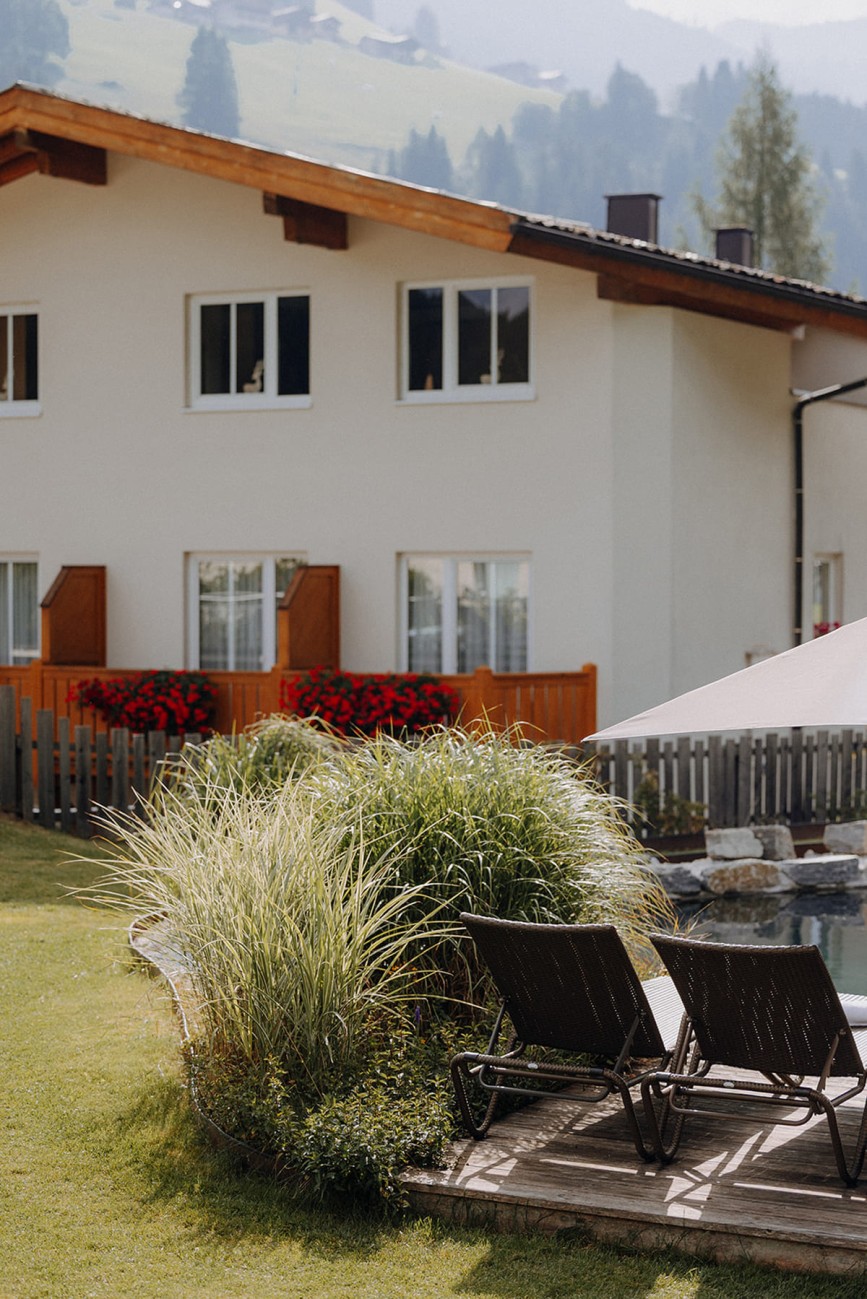 Summer vacation at Botenwirt with relaxing moments on the sunbathing lawn by the natural swimming pond.